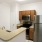 a kitchen with a stainless steel refrigerator