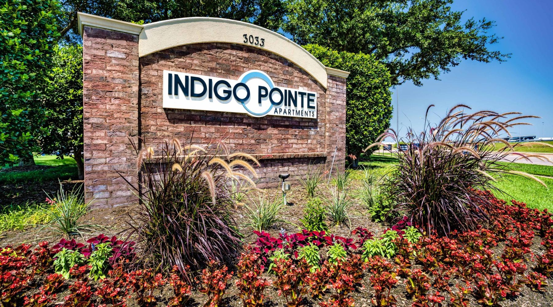Find your perfect fit at Indigo Pointe a sign on a brick building