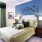 a bedroom with a bed and lamps