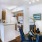 a living room with a dining table and chairs